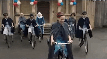 Biking Women In Festive Parade GIF