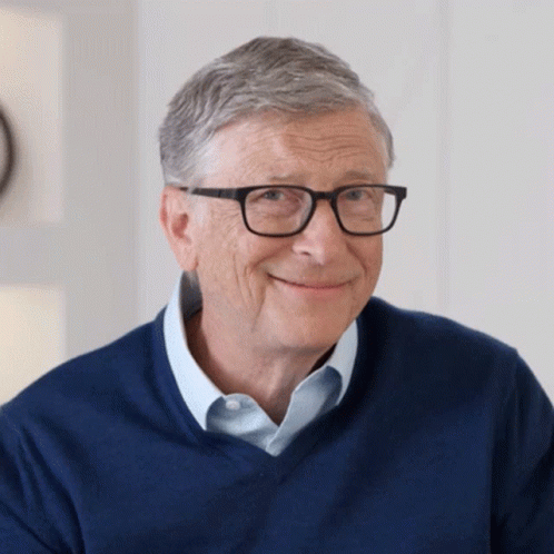 Bill Gates Smiling In Glasses And Blue Shirt GIF