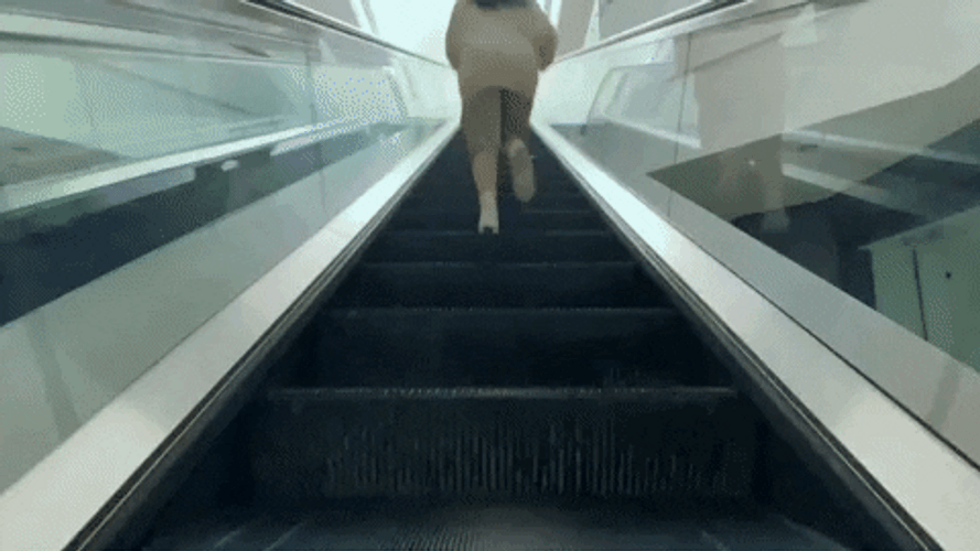 Billie Eilish Escalator Run GIF