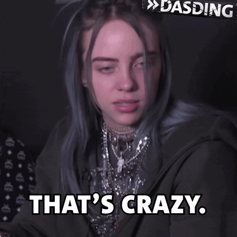 Billie Eilish In Black Jacket And Necklaces Saying That's Crazy GIF