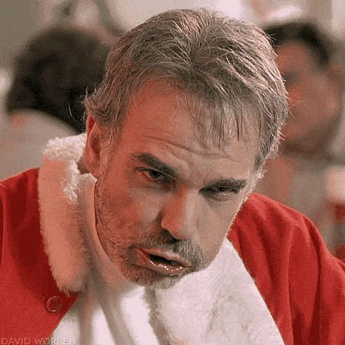 Billy Bob Thornton As Santa Chewing GIF
