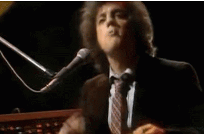 Billy Joel Smoking Cigar While Performing GIF