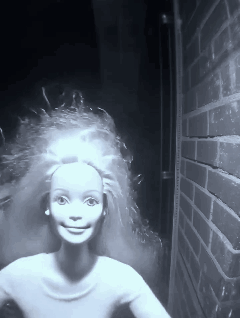 Black and White Barbie Doll with Brick Wall