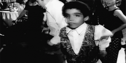Black and White Boy Dancing in Crowd