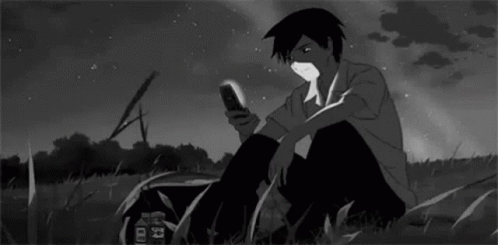 Black and White Boy Looking at Cell Phone