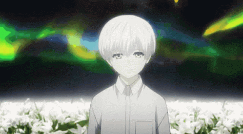 Black and White Boy Standing in Field of Flowers