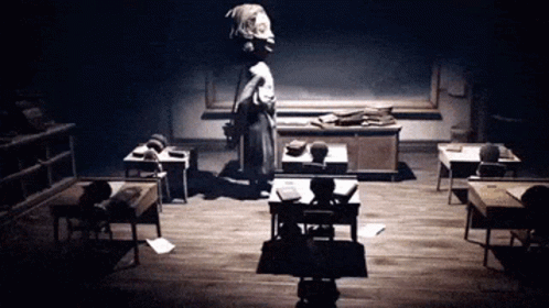 Black and White Classroom With Woman Standing