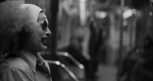 Black and White Clown in White Hat and Tie