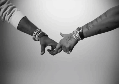 Black and White Couple Holding Hands