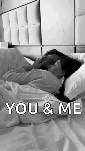 Black and White Couple Hugging in Bed