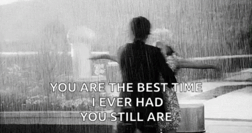 Black and White Couple Hugging in Rain With Quote