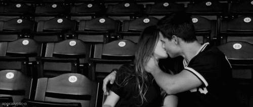 Black and White Couple Kissing in Empty Stadium Seats 10 13