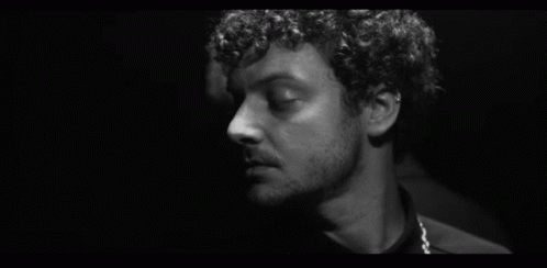 Black and White Curly Haired Man Looking at Another