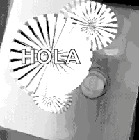 Black And White Fireworks Display Saying Hola GIF