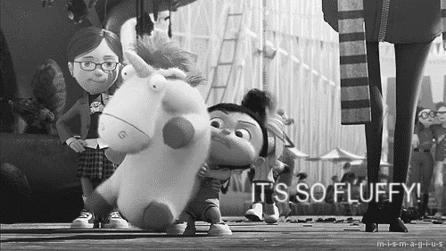 Black and White Girl Holding Stuffed Unicorn It's So Fluffy