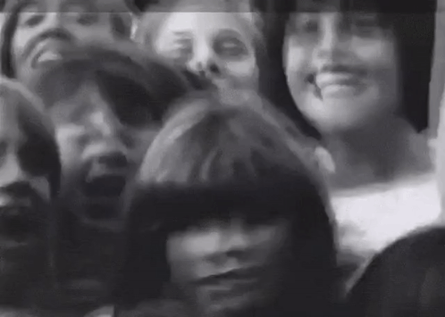 Black And White Group Sitting In Room GIF