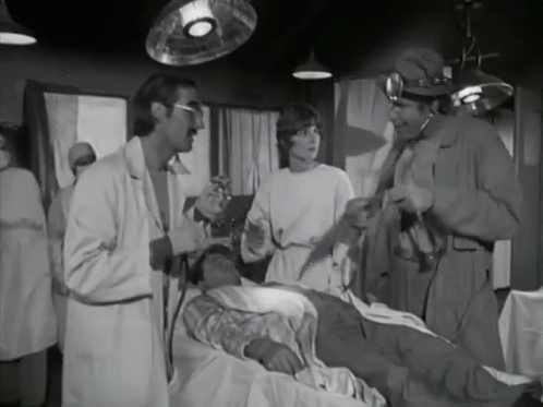Black and White Group Talking to Patient