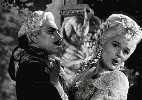 Black and White Man and Woman in Costumes