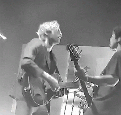 Black and White Man and Woman Playing Guitar and Bass