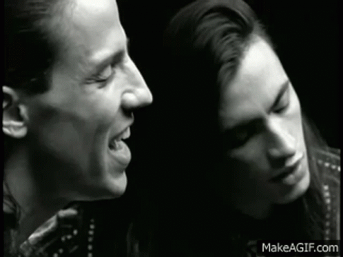 Black And White Man And Woman Singing GIF