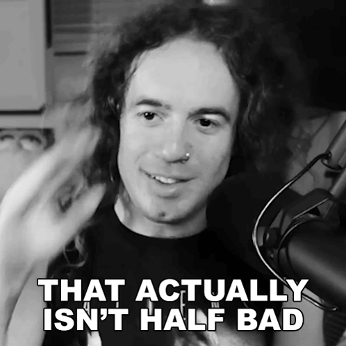 Black and White Man at Microphone Saying That Actually Isn't Half Bad