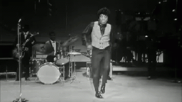 Black and White Man Dancing on Stage