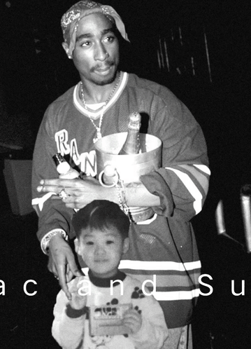 Black And White Man Holding Bucket Of Champagne And Little Boy GIF
