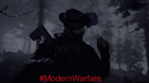 Black And White Man Holding Gun With ModernWarfare Red Text GIF