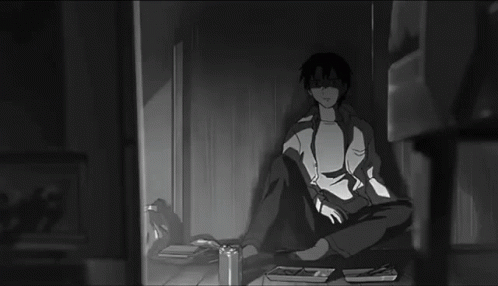 Black And White Man Holding Remote In Dark Room GIF