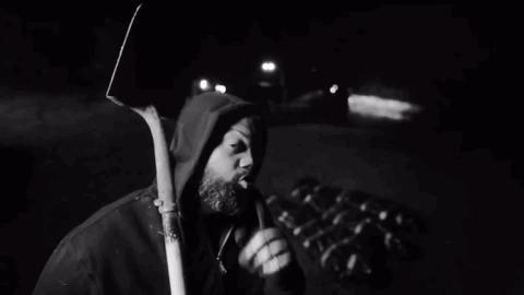 Black And White Man Holding Shovel GIF