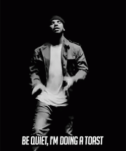 Black And White Man In Beanie Jacket Mic GIF