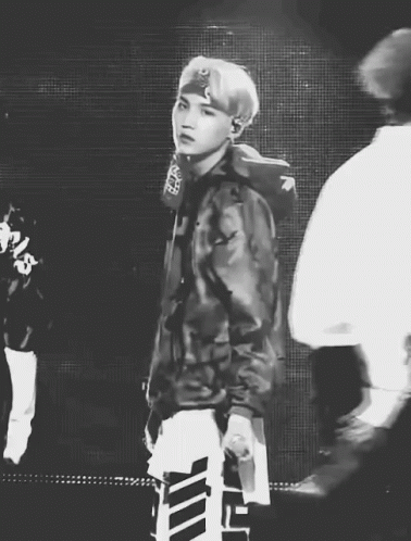 Black And White Man In Camo Jacket Holding Microphone GIF