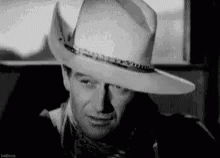 Black and White Man in Cowboy Hat and Scarf