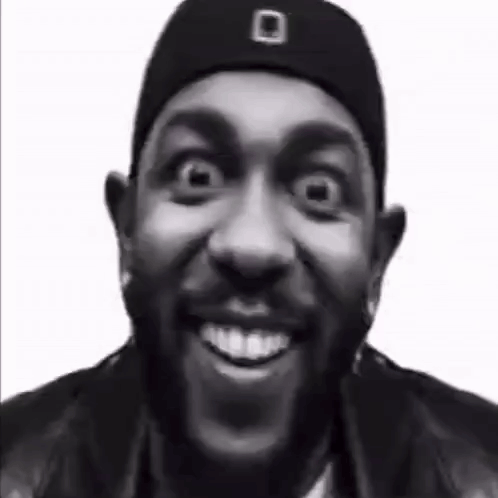 Black and White Man in Hat and Jacket Making Funny Face