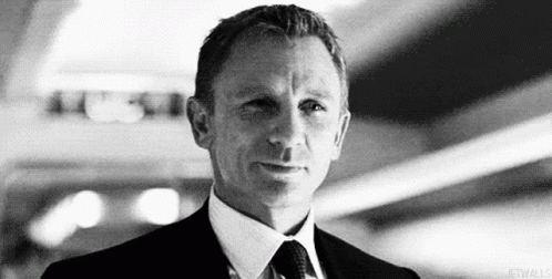 Black and White Man in Suit and Tie Looking at Camera