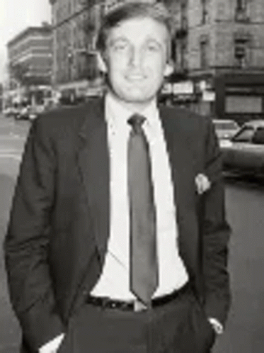 Black and White Man in Suit and Tie on City Street