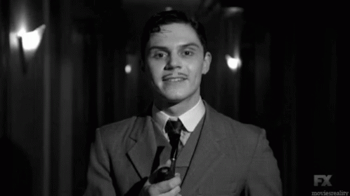 Black and White Man in Suit and Tie With FX