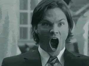 Black and White Man in Suit With Open Mouth