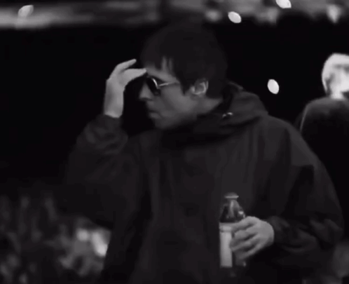 Black and White Man in Sunglasses Drinking From Can