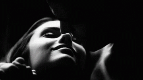 Black And White Man Kissing Woman On Cheek GIF
