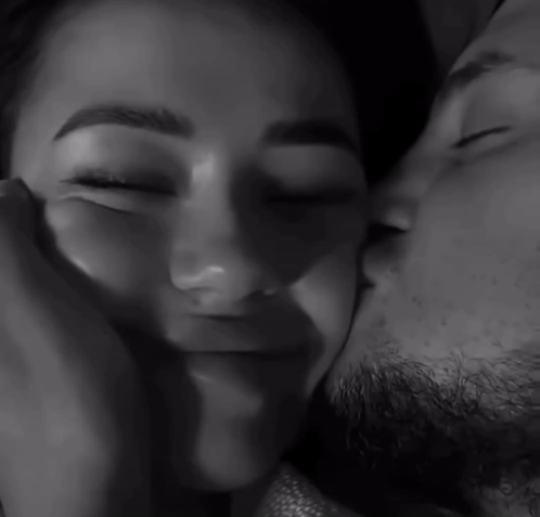 Black And White Man Kissing Woman's Forehead GIF