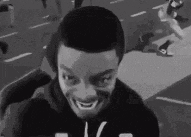 Black and White Man Making Funny Face on Street