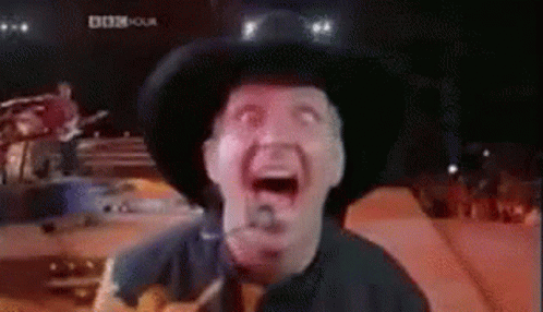 Black And White Man Playing Guitar On Stage GIF