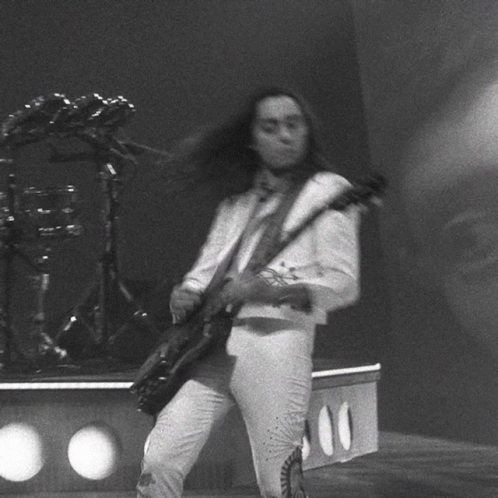 Black And White Man Playing Guitar On Stage GIF