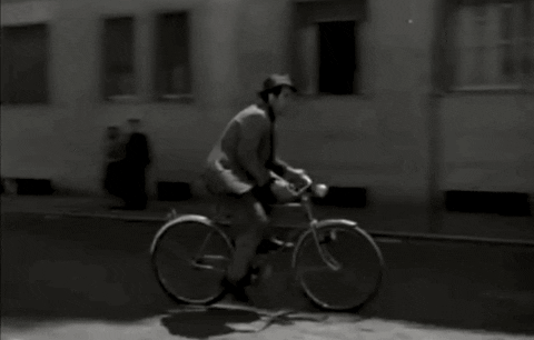 Black And White Man Riding Cycle GIF