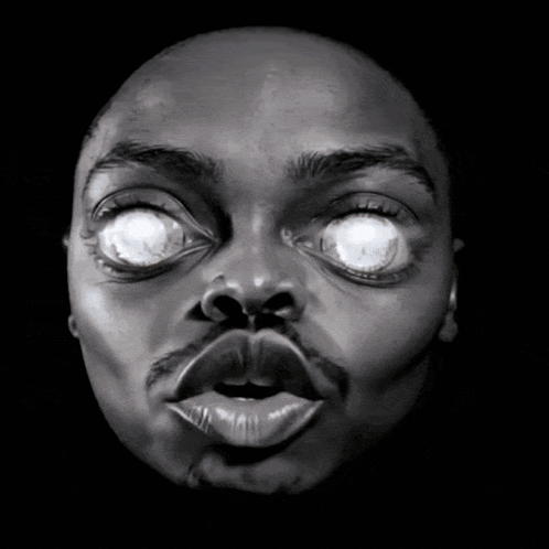 Black and White Man's Face with Glowing Eyes