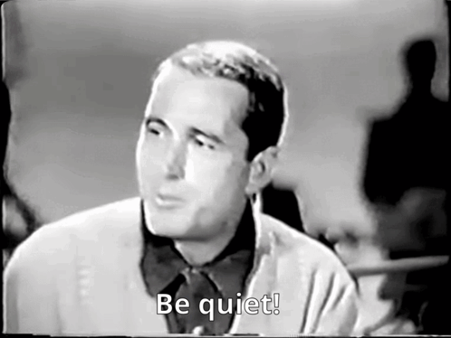 Black and White Man Saying Be Quiet