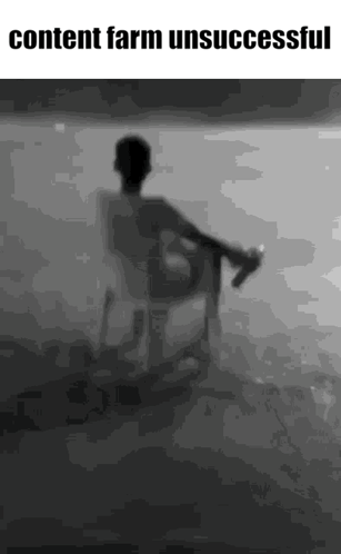 Black and White Man Sitting Holding Water Bottle