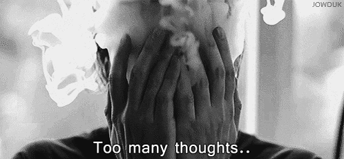 Black And White Man Smoking Cigarette Covering Face GIF
