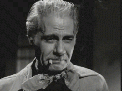 Black and White Man Smoking Cigarette